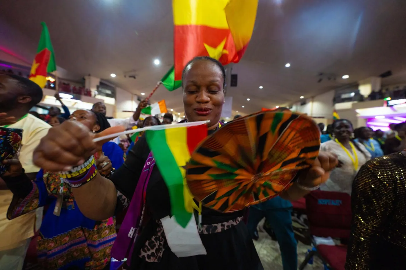 Delegates dancing with cultural flags