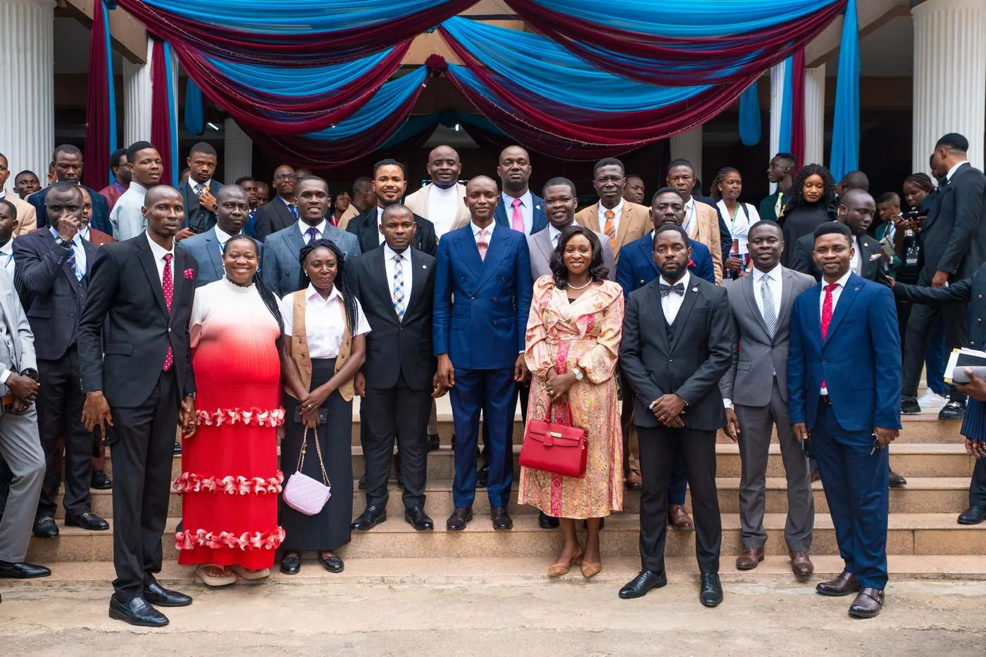 Young delegates gathered on the steps between sessions at Canaanland