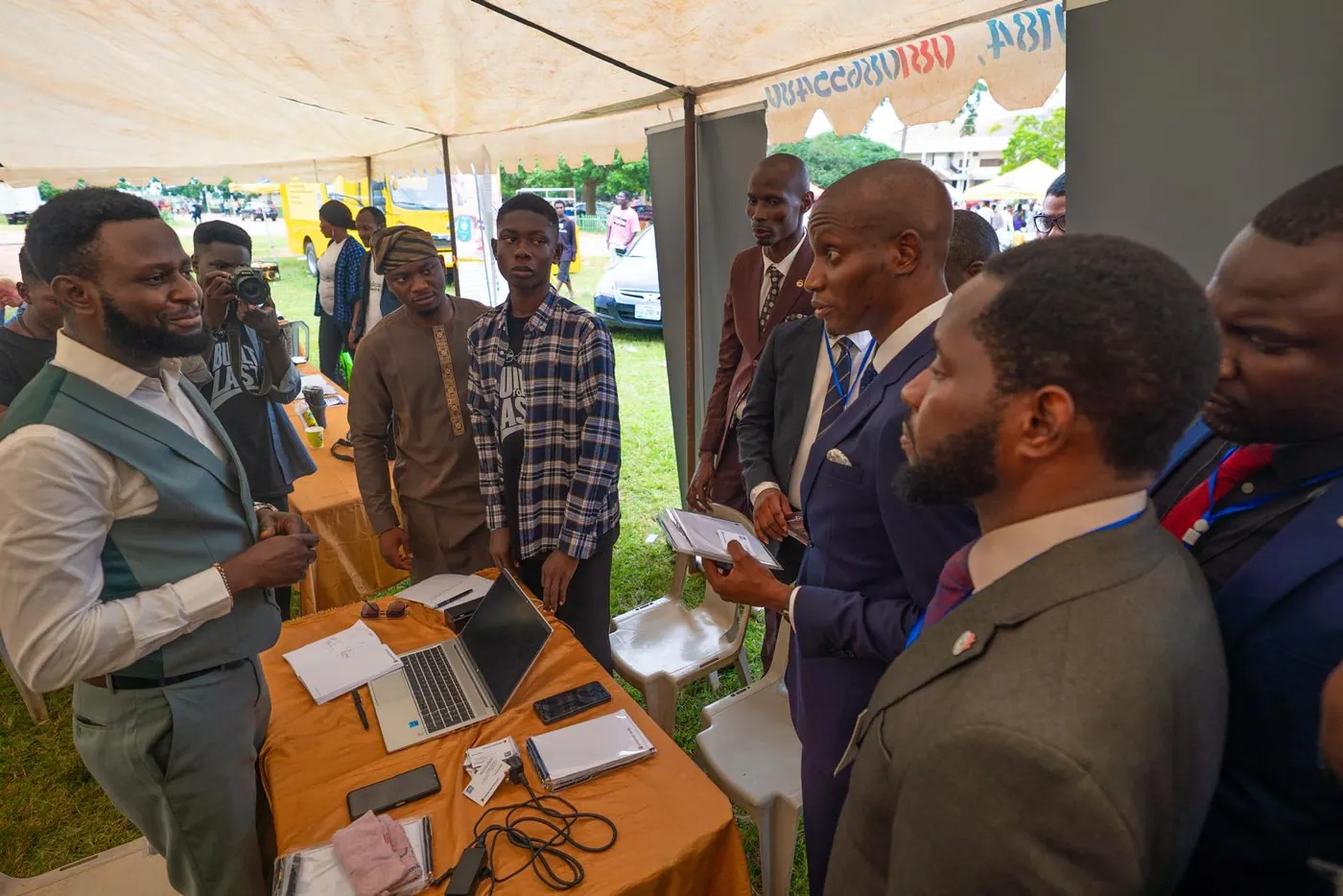 Delegates meeting a recruiter at an employer booth during the job fair