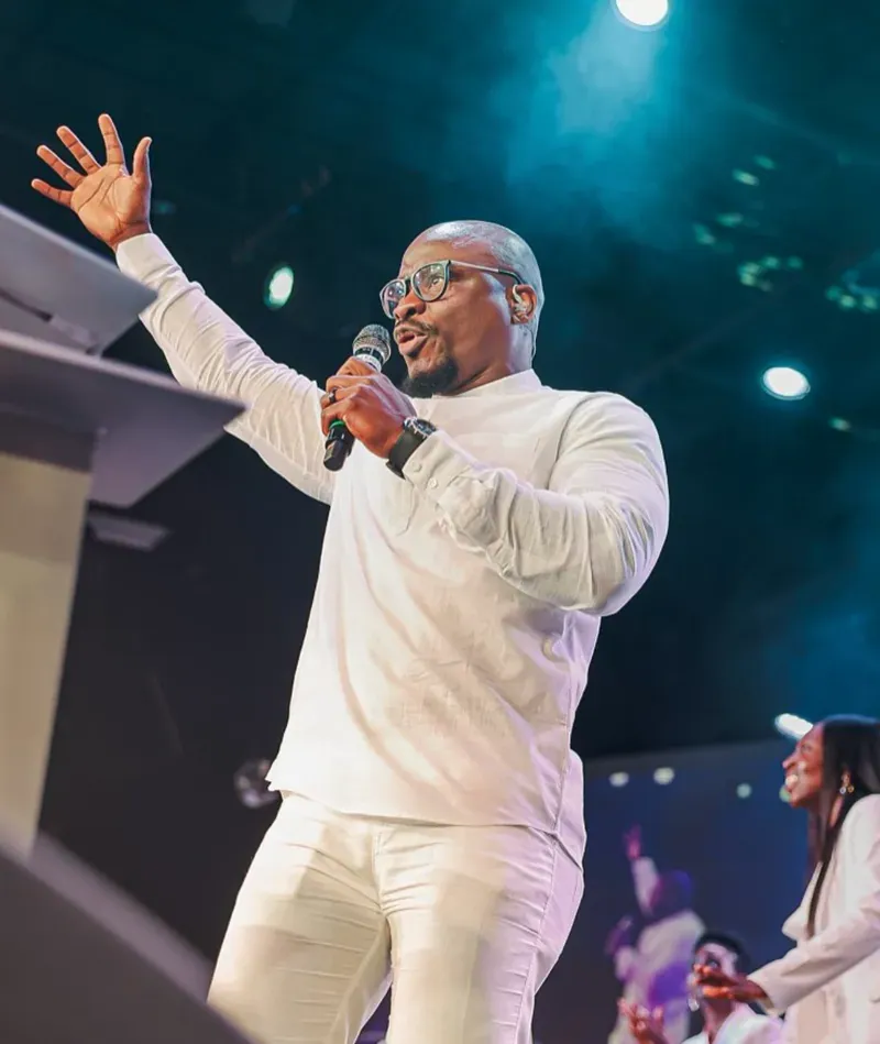 A minister preaching on stage at Youth Alive USA