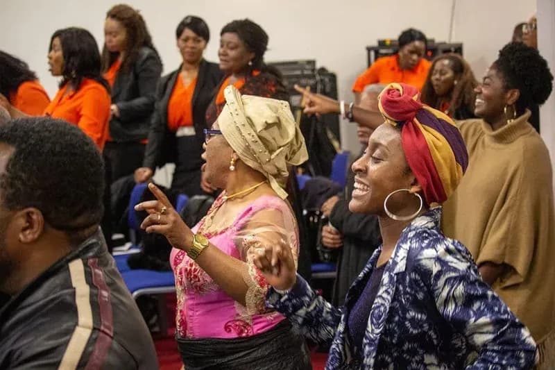Members rejoicing together during a praise gathering