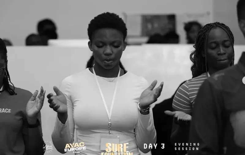 A delegate in prayer during the Sure Foundation session