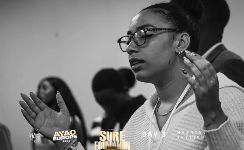 A delegate gesturing during a morning session